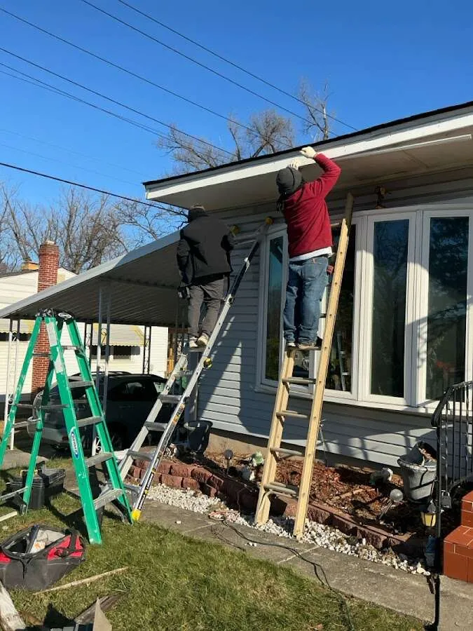 Restoration crew performing exterior repair in Morrow